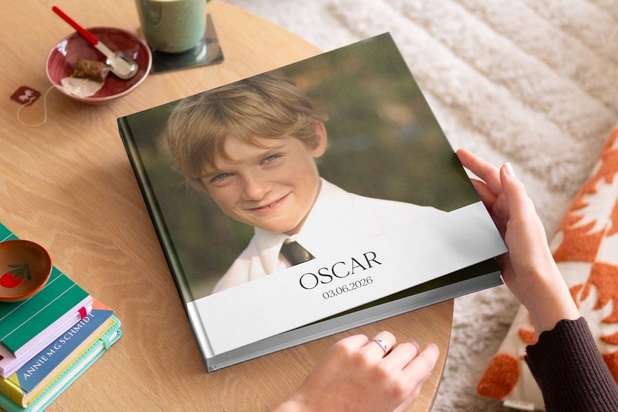 Een gepersonaliseerd eerste communie fotoboek vol herinneringen, als voorbeeld van een blijvende herinnering aan de eerste communie 2026 bij albelli.
